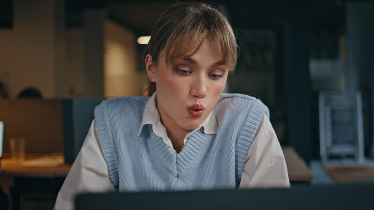 Pondering girl analyzing project looking computer thinking at office closeup