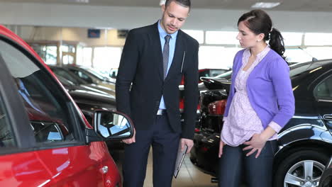 businessman presenting a car