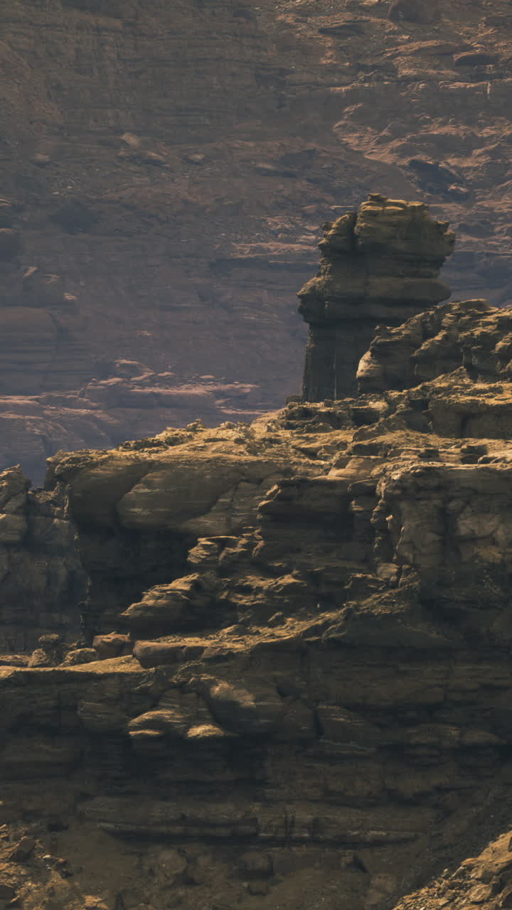 Dramatic rock formations rise majestically under the fading light of dusk