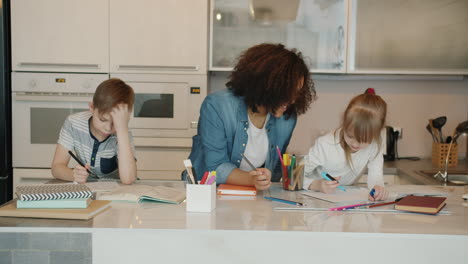 children doing homework in kitchen