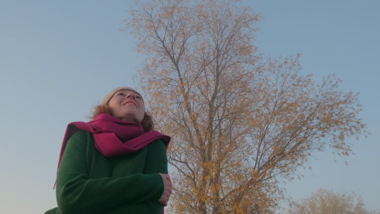 Woman enjoying a beautiful autumn morning