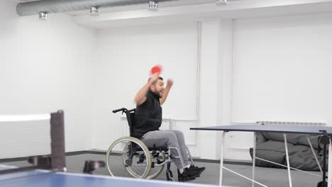a young man in a wheelchair plays table tennis in the hall wheelchair tennis a young man in a wheelchair plays table tennis in the hall wheelchair tennis video