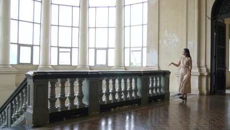 grandeur windows, manor house location, balustrade, woman, slow motion