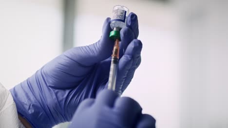 Video-of-human-hands--with-coronavirus-medicine-and-a-syringe