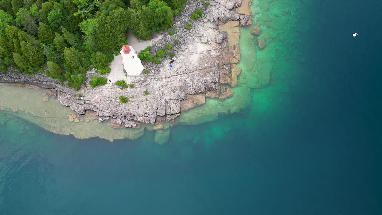 Aerial View of a Lighthouse on a Rocky Coast