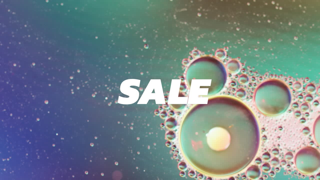 액체 및 baubles의 클로즈업 위에 판매 텍스트의 애니메이션