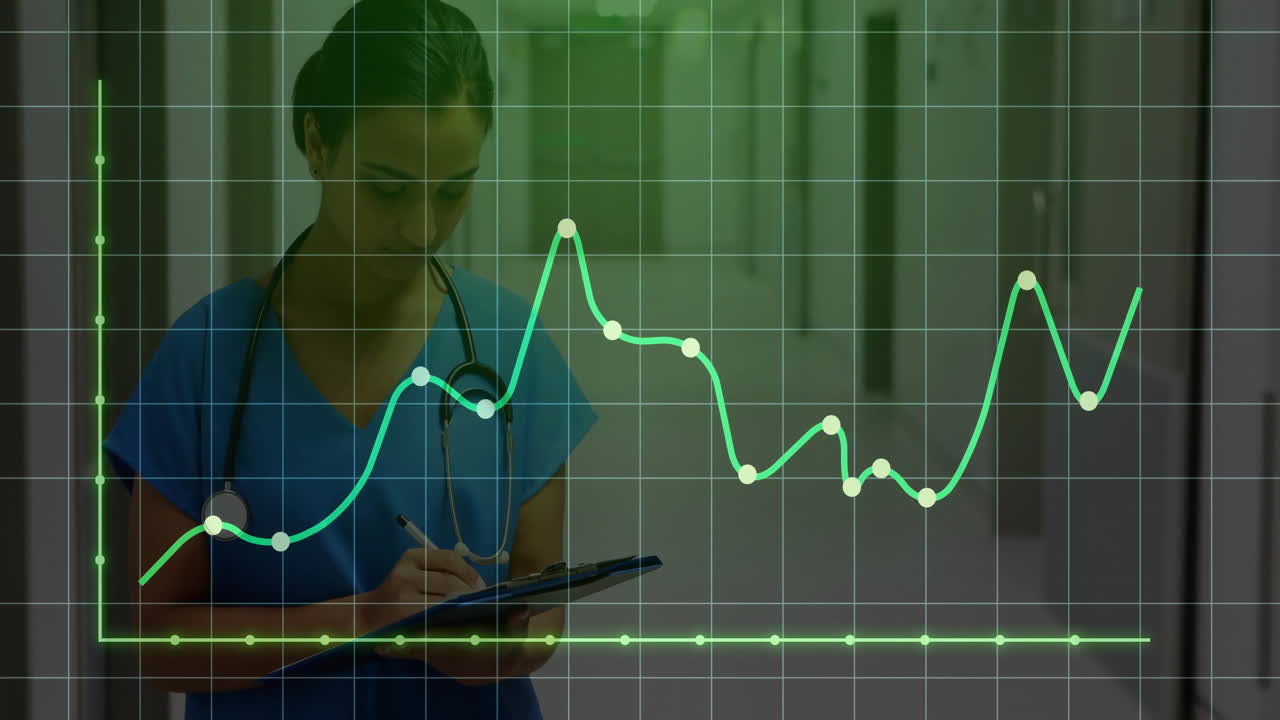 Medical professional writing on clipboard in hospital hallway, showing animated green line graph