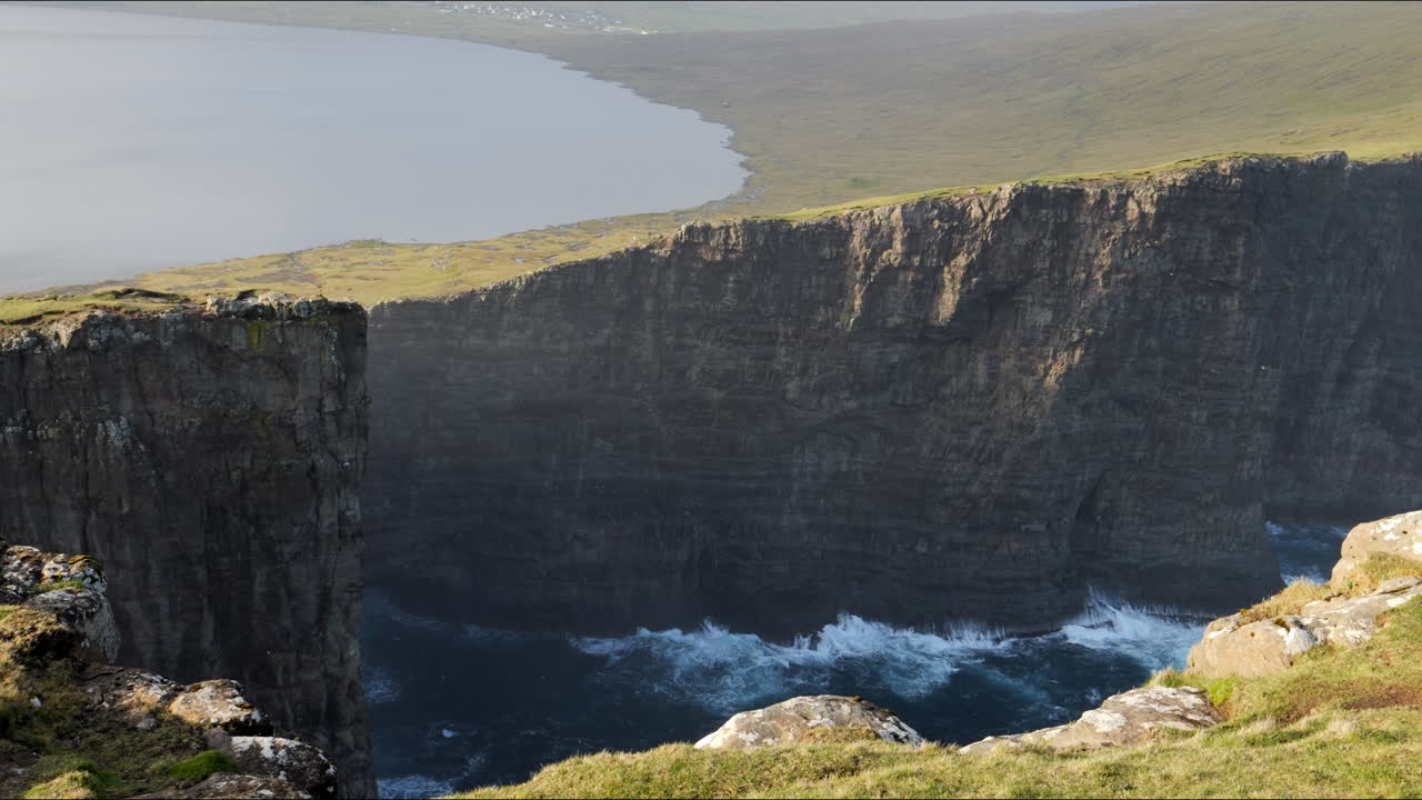 Beatifull Fantastic panoramic shot over Vestmanna cliffs and S&oslash;rv&aacute;gsvatn lake in the Faroe Islands in Sunset