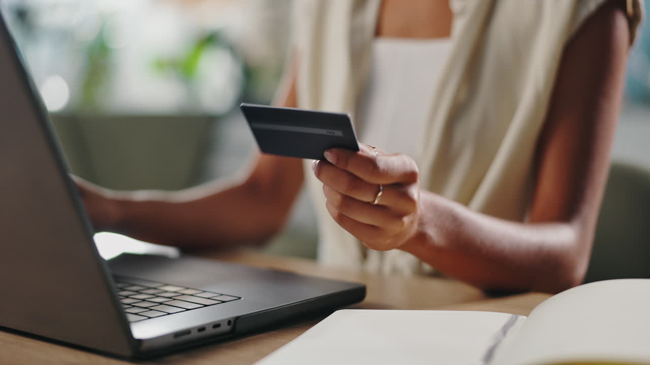 Woman making online purchase using a credit card