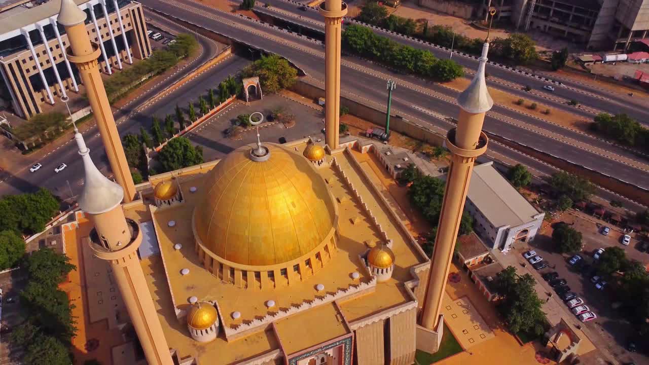 Jib up of the beautiful decorative golden dome on top of the Abuja National Mosque in Nigeria, Africa