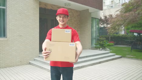 delivery man uniform smiles during express, courier holding a small package parcel delivering goods to customer's home with van truck, door-to-door services