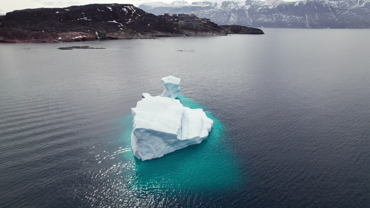Aerial View of Iceberg at the Coast of Uummannaq Greenland - Pan Shot