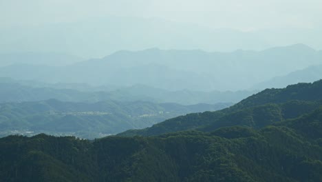 Locked-off-view-over-mountain-ranges-with-silhouettes-mountains-in-distance