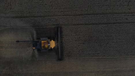 Top-down-view-of-combine-harvester-harvesting-field-of-grain