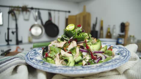 Close-up-shot-of-a-beautifully-plated-salad-on-table-in-home-kitchen