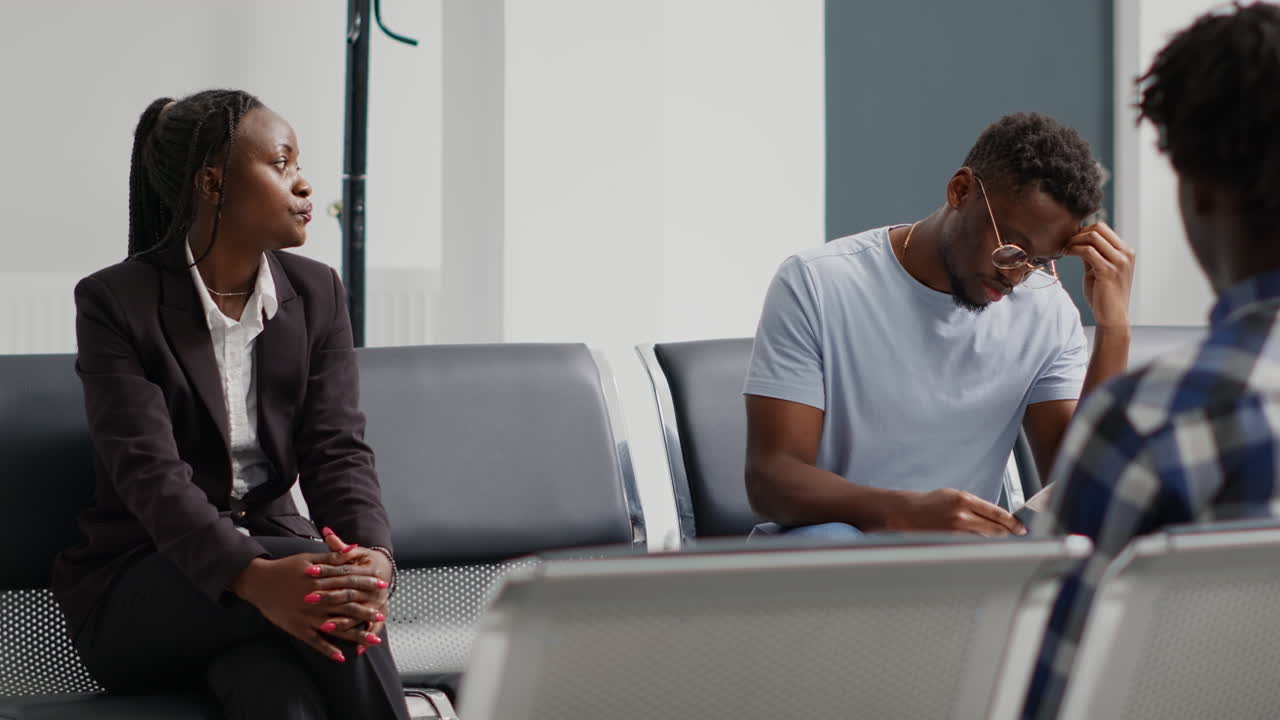 Group of patients sitting in hospital waiting room
