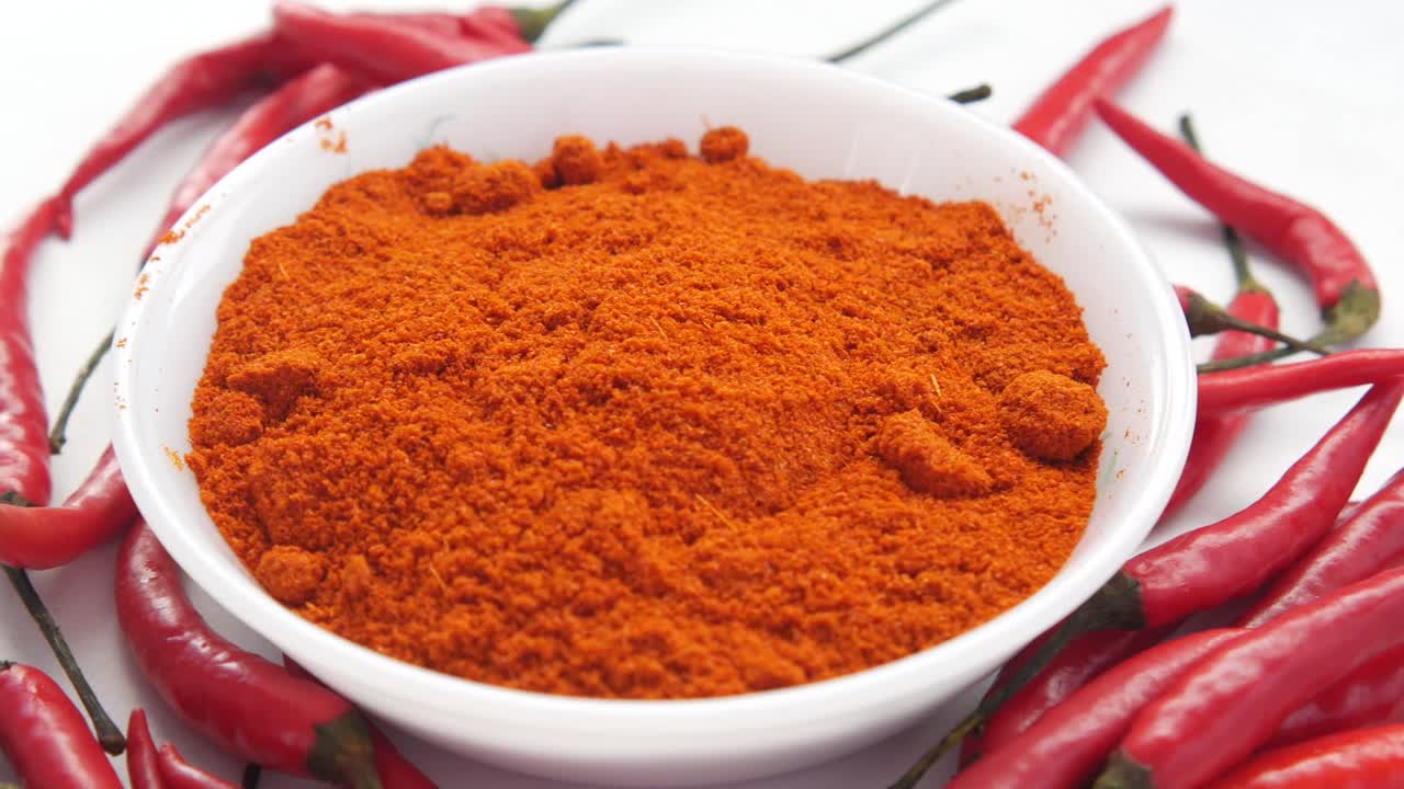 Chili Powder in a Bowl with Chili Peppers