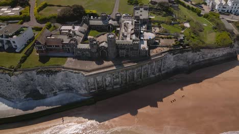 kingsgate castle kent seaside english chalk cliff coastal bay landmark aerial view rising pull back