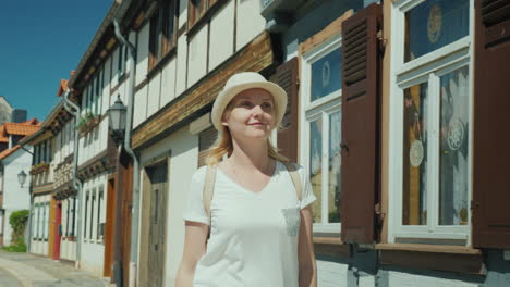 Happy-Woman-Admires-Old--German-Street