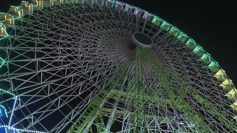 Gigantic-Ferris-Wheel-With-Christmas-Lights-Spinning-At-Night-In-Vigo,-Galicia,-Spain