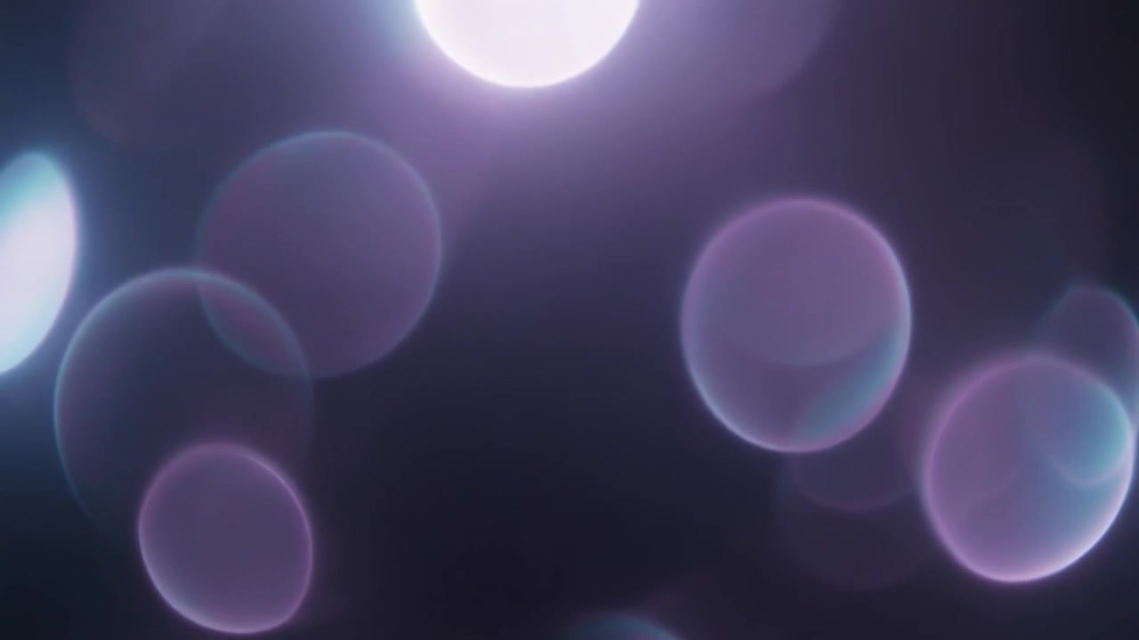Abstract Background with Soft Purple and Blue Bokeh Light Orbs