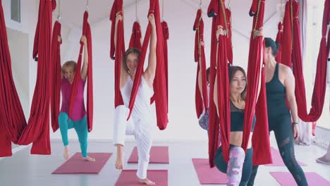 professional-coach-gives-modern-anti-gravity-yoga-lesson