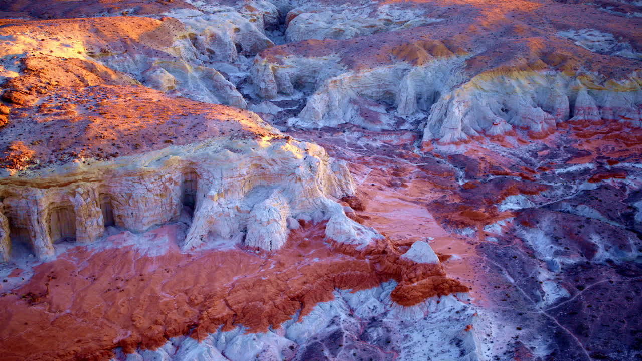 Slow, sweeping drone footage glides over the colorful hills and fascinating rock structures near the Utah-Arizona border.