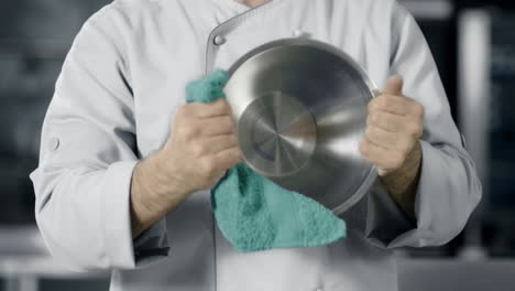 chef man preparing to cook in restaurant kitchen