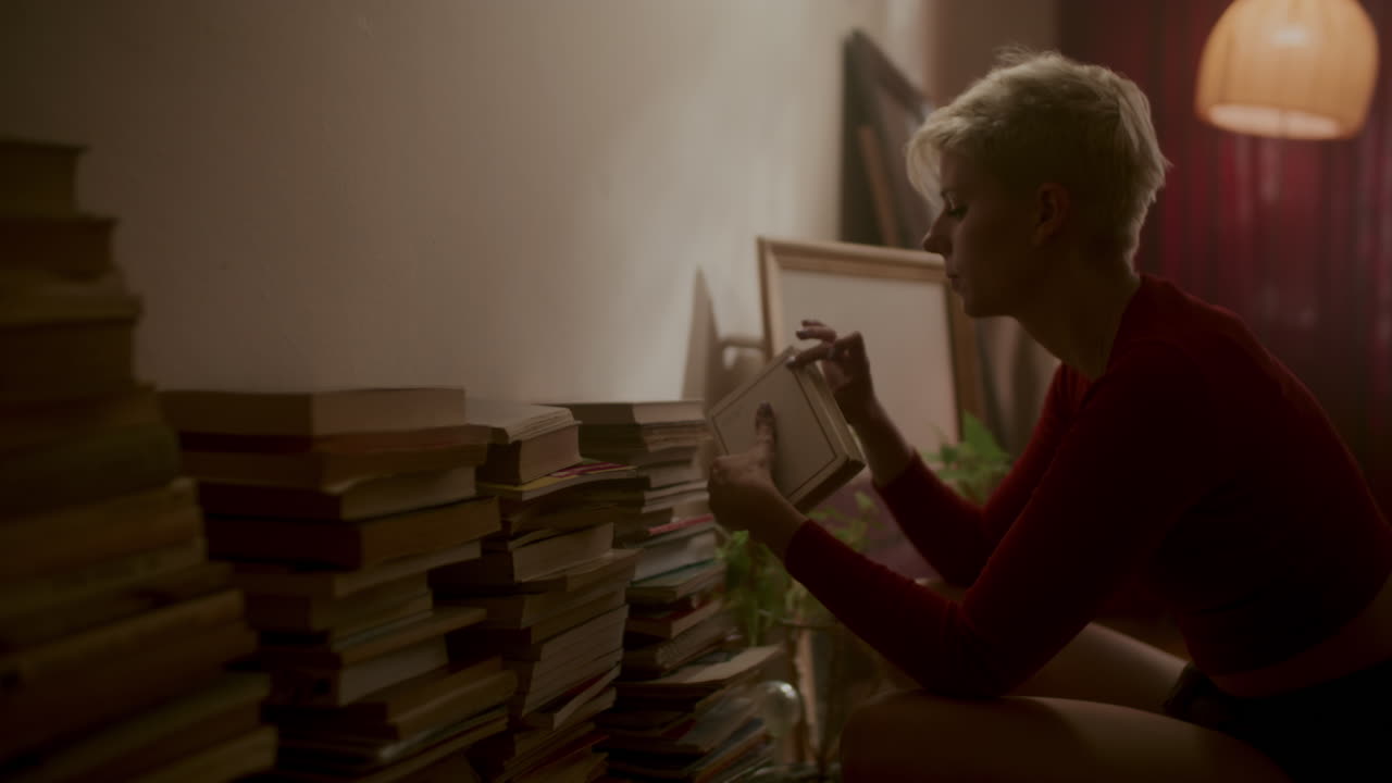 Woman Reading Books at Night