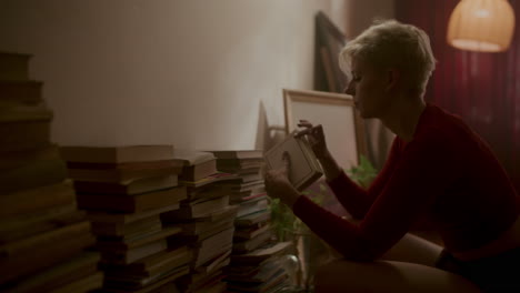 woman reading books at night
