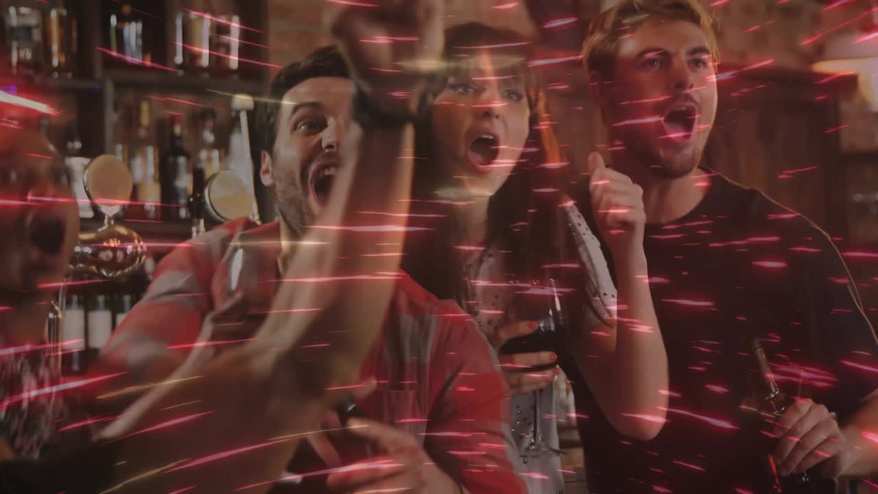 group of friends reacting to swirling red lights in nightlife bar and bursting into joyful cheers