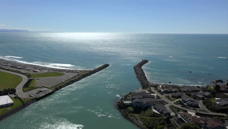 aerial forward over pier of brookings harbor in oregon