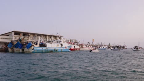 Fishing-port-with-fishing-boats-and-fish-market-in-a-port-in-Spain,-Villajoyosa,-Alicante,-Mediterranean-Sea