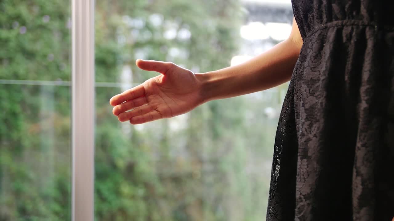 Close up man and woman shaking hands quickly