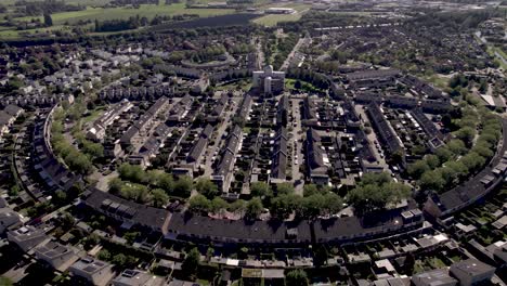 forward approach aerial of residential neighbourhood leesten in suburbs of zutphen with distinct shape