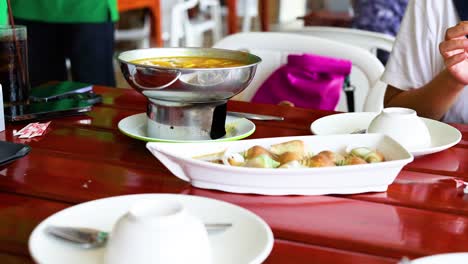 thai restaurant meal with hot pot and seafood