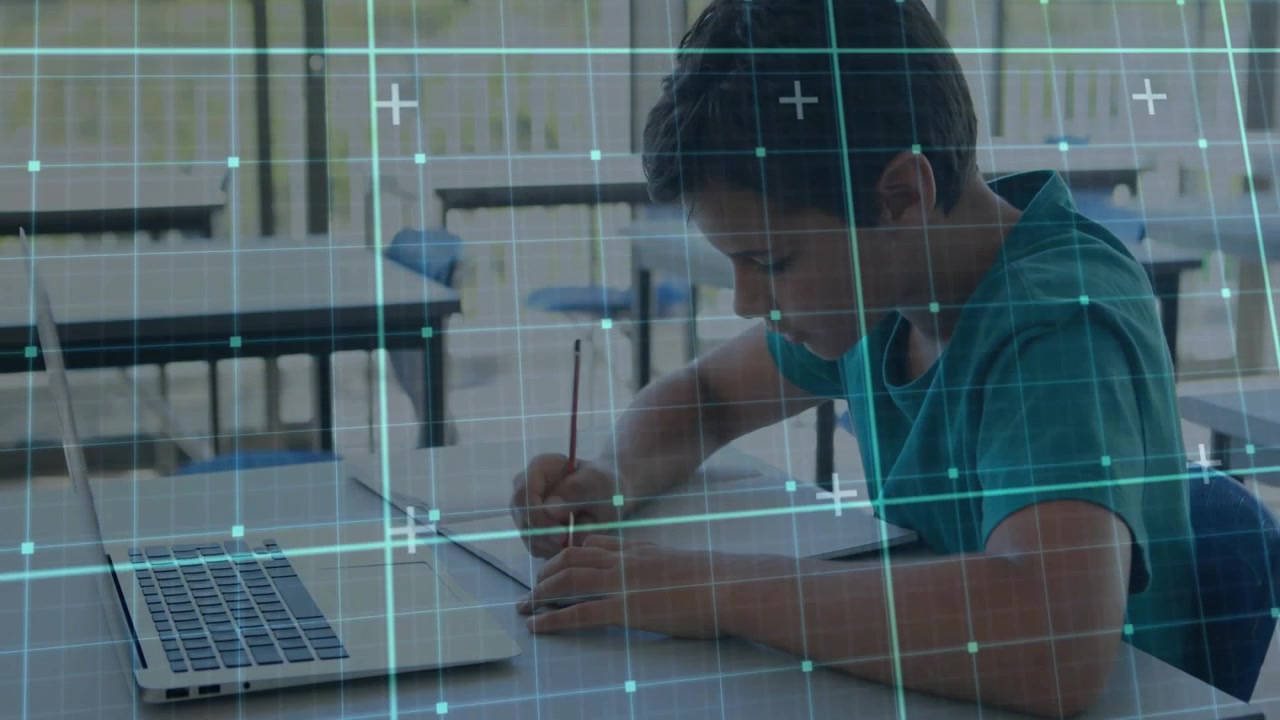 Boy student picking pencil and writing work on paper, laptop idling, turquoise grid moving in class