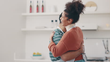 love, smile and couple dance in the kitchen