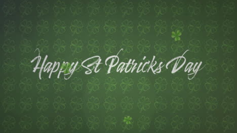 animation of the words happy st. patrick's day written on green clovers background