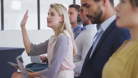 Business-people-attending-to-a-meeting-in-conference-room