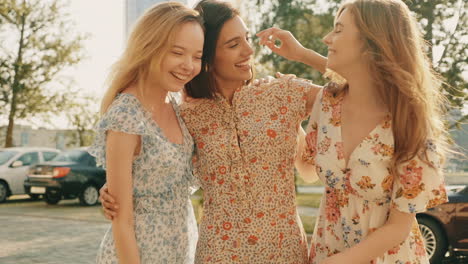 three happy women friends enjoying a day out