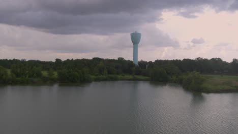 urban bayou and water tower in houston’s alief area – 4k drone footage