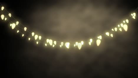 glowing string of fairy lights on grey background