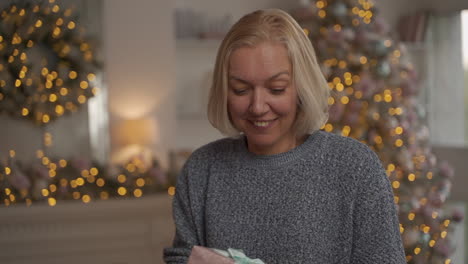 od happy woman holding a christmas present