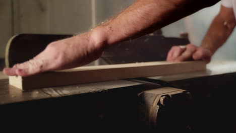 carpenter using a planer