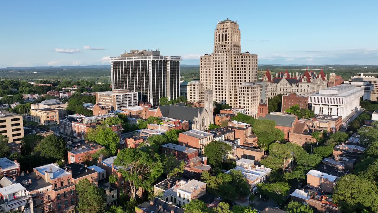 Panorama drone shot of New York State Capitol, Alfred E. Smith State Office building and One Commerce Plaza in Albay downtown, New York. Sunny day with green trees in summer