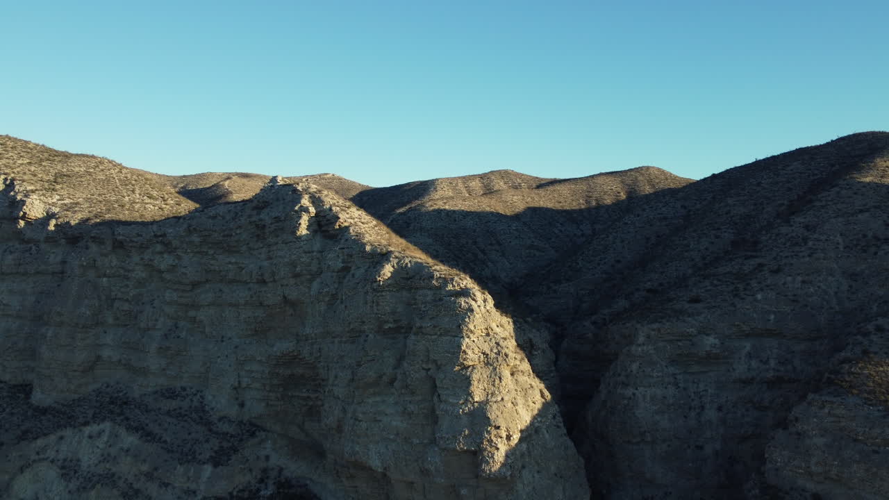 Mountainous Landscape with Canyon and Shadows