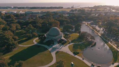 aerial shot flying towards galileo galilei planetarium at sunrise in buenos aires