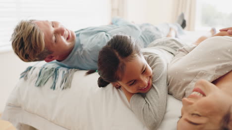 Happy-family,-bed-and-child-playing-in-a-bedroom