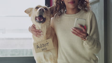 african woman taking a selfie with her dog